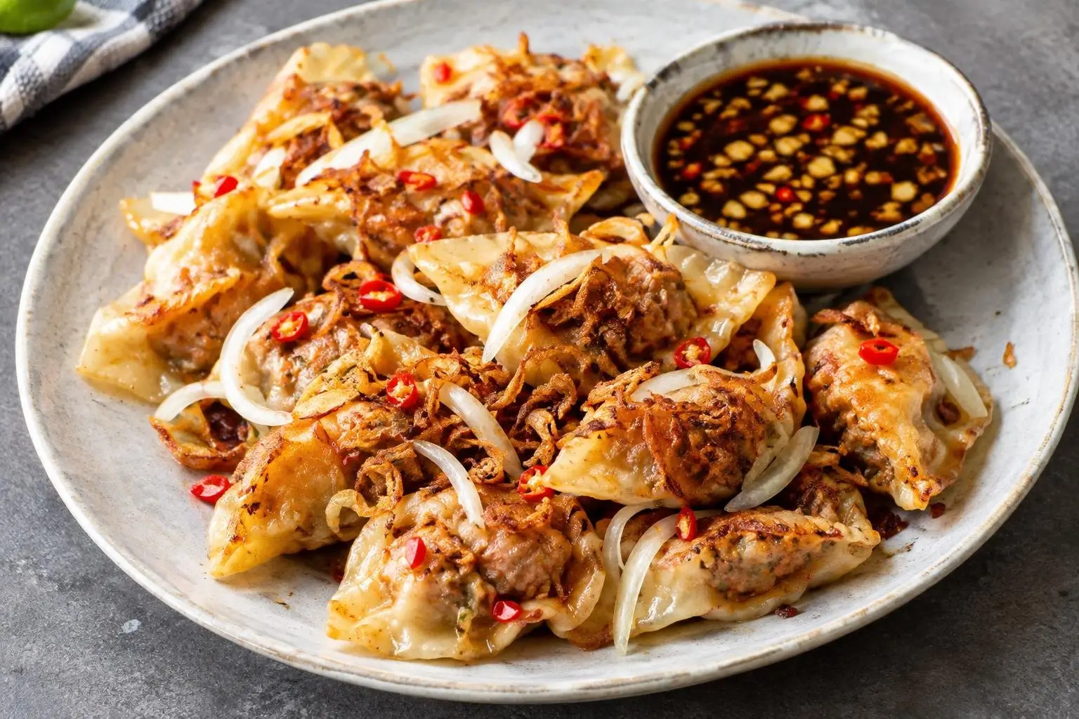 Pork Sisig Dumplings with Garlic Soy Dipping Sauce plated and ready to serve