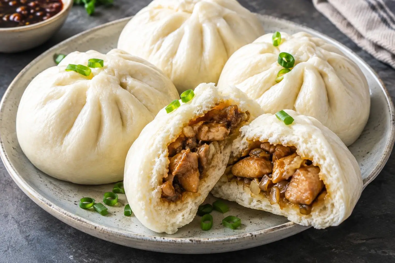 Filipino Chicken Siopao with Steamed Bun plated and ready to serve
