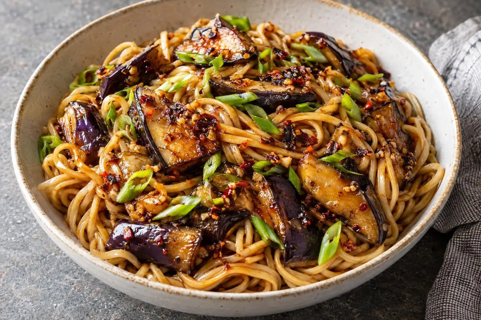 Chilli crisp aubergine noodles plated and ready to serve