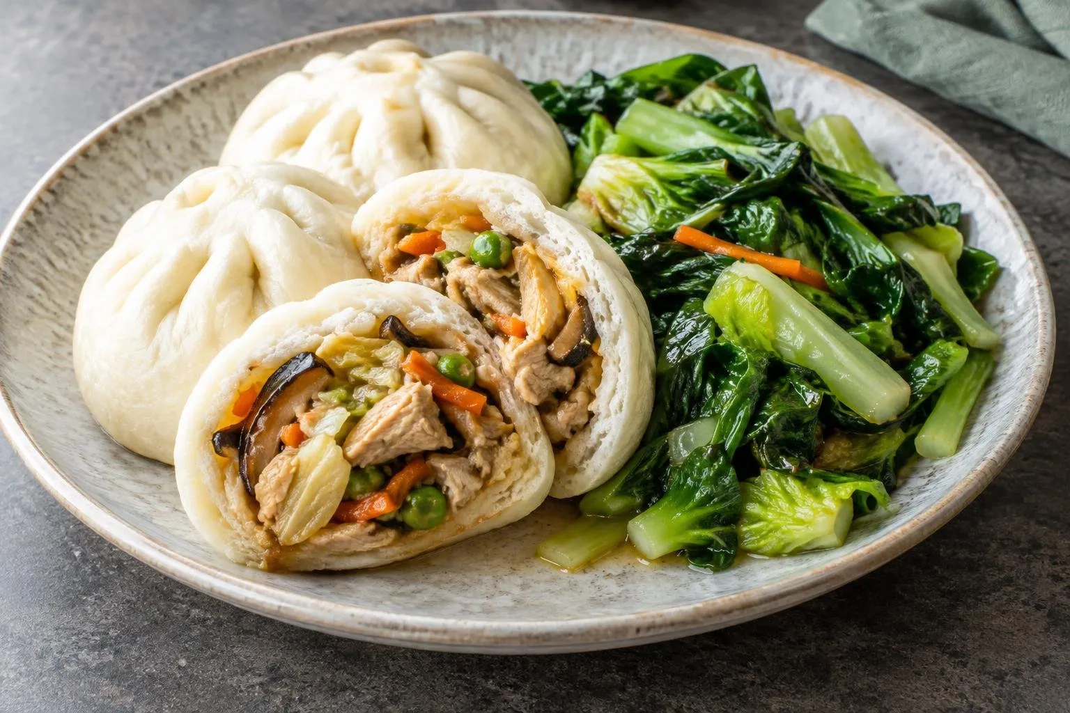 Chicken and Vegetable Siopao with Seasonal Greens plated and ready to serve